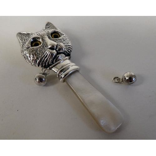 188 - A baby's Sterling silver Louis Wain inspired rattle in the form of a cat 