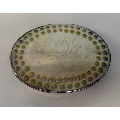 2 - A silver coloured metal oval patch box, set with an engraved mother-of-pearl tablet and around the r... 