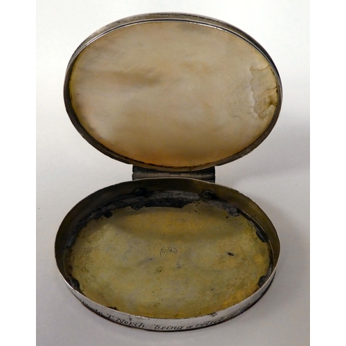 2 - A silver coloured metal oval patch box, set with an engraved mother-of-pearl tablet and around the r... 