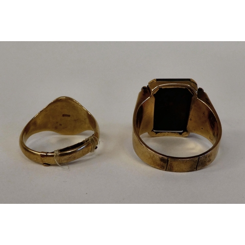 22 - A 9ct gold signet ring with an engraved armorial and a gold coloured metal signet ring, set with a b... 