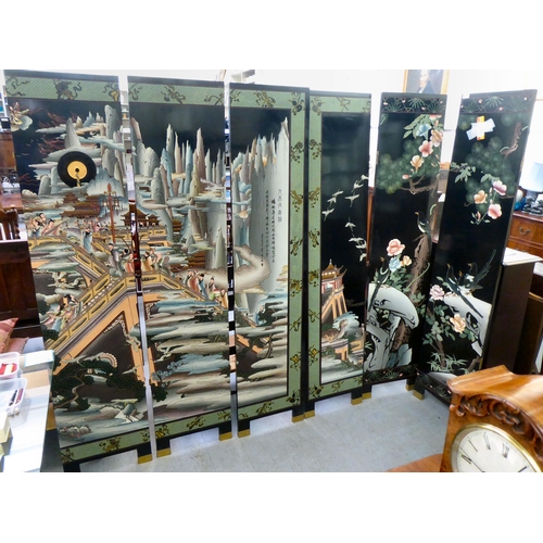 24 - A post World War II Oriental black lacquered and overpainted, six panel dressing room screen, decora... 