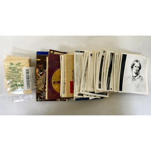 25 - Uncollated used postage stamps; banknotes; cigarette cards; postcards; and handwritten ephemera