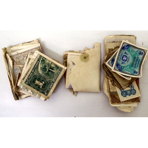 25 - Uncollated used postage stamps; banknotes; cigarette cards; postcards; and handwritten ephemera