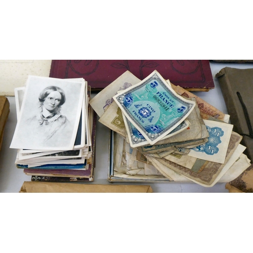 25 - Uncollated used postage stamps; banknotes; cigarette cards; postcards; and handwritten ephemera