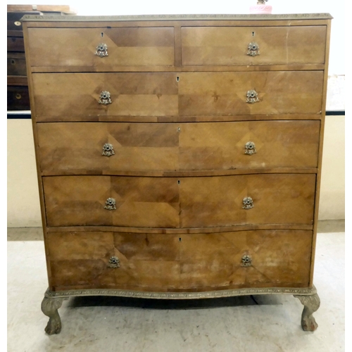 290 - A mid 20thC crossbanded, bleached mahogany finished, serpentine front, six drawer dressing chest, ra... 