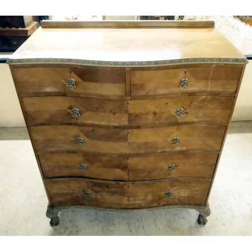 290 - A mid 20thC crossbanded, bleached mahogany finished, serpentine front, six drawer dressing chest, ra... 