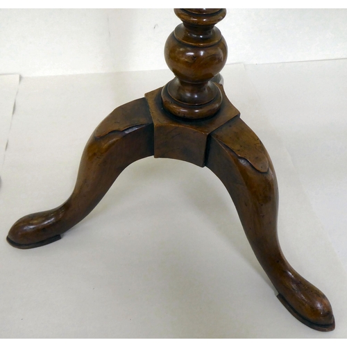 3 - A 19thC style walnut wine table with a quarter veneered hexagonal top, over a tapered column, raised... 