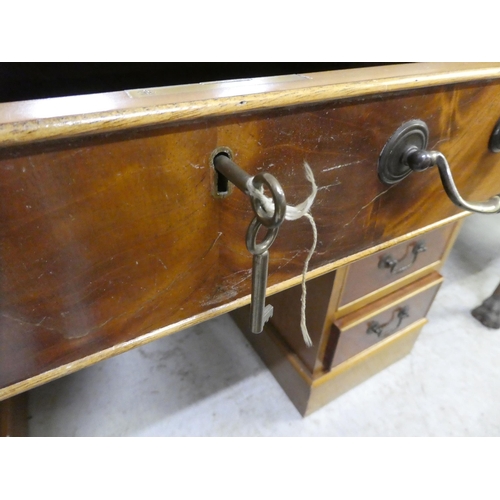 304 - A modern mahogany nine drawer, twin pedestal desk, on a plinth  30