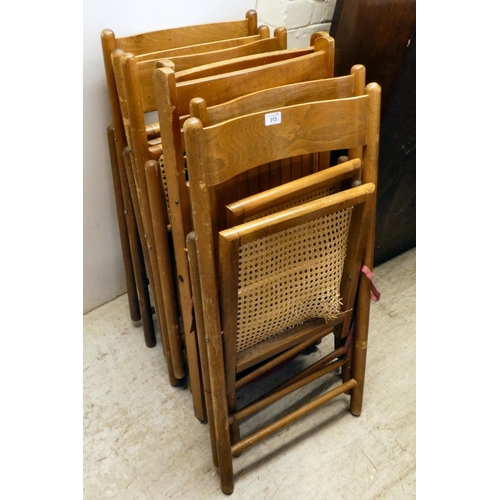 313 - Seven similar, mainly beech framed folding chairs with either caned or panelled seats