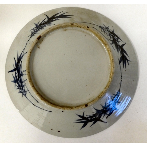 323 - 19thC and later Oriental ceramics: to include a Chinese porcelain charger, decorated in blue and whi... 