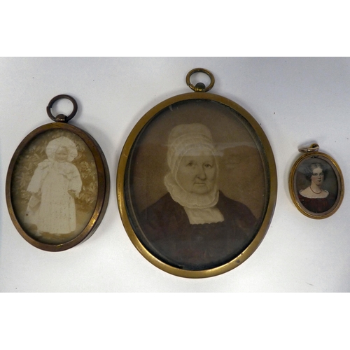 326 - Prints and portrait miniatures in enamelled and other oval frames 