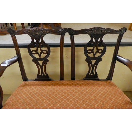 333 - An early/mid 20thC Georgian design,  mahogany twin carved, splat back, open arm two person settee, r... 