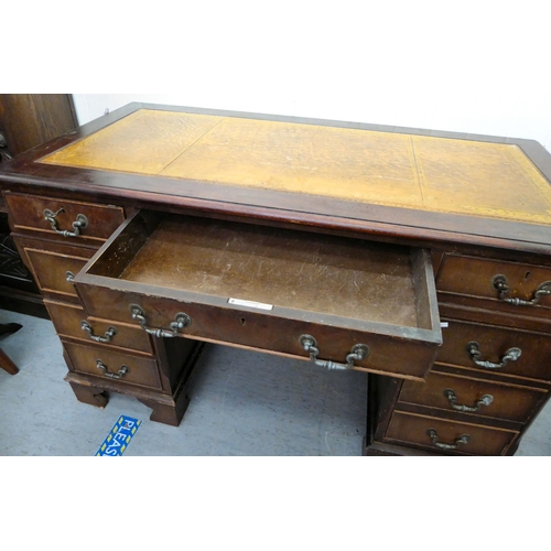 35 - A modern mahogany finished nine drawer, twin pedestal desk, the top set with a tooled scriber, raise... 