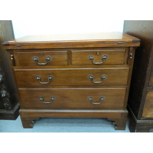 40 - A modern Georgian design mahogany bachelor's chest with a foldover top and two short/two long drawer... 