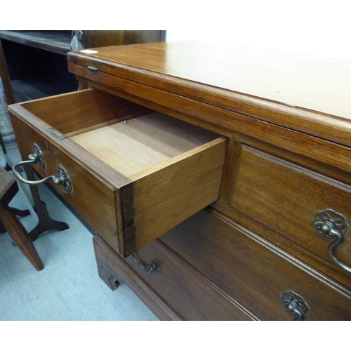 40 - A modern Georgian design mahogany bachelor's chest with a foldover top and two short/two long drawer... 