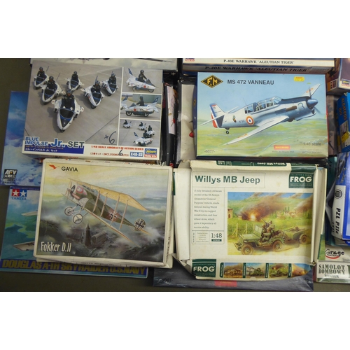 49 - 1/48 scale model kits: to include a Tamiya, Douglas A-1H Skyraider; and a P-40E Warhawk by Hasegawa&... 