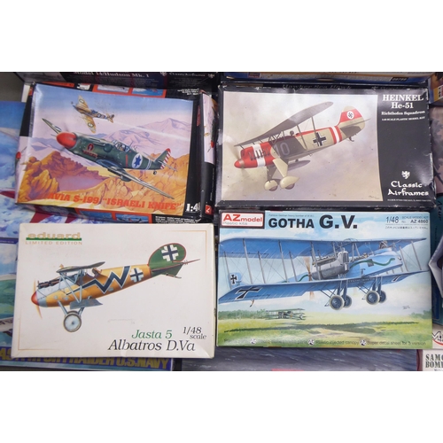 49 - 1/48 scale model kits: to include a Tamiya, Douglas A-1H Skyraider; and a P-40E Warhawk by Hasegawa&... 