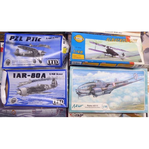 49 - 1/48 scale model kits: to include a Tamiya, Douglas A-1H Skyraider; and a P-40E Warhawk by Hasegawa&... 