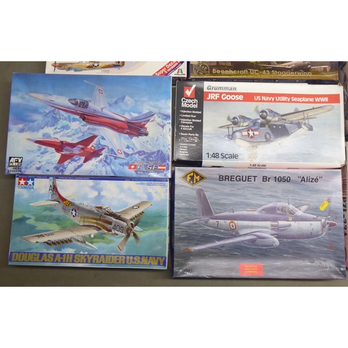 49 - 1/48 scale model kits: to include a Tamiya, Douglas A-1H Skyraider; and a P-40E Warhawk by Hasegawa&... 