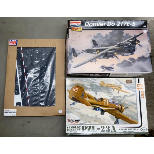 49 - 1/48 scale model kits: to include a Tamiya, Douglas A-1H Skyraider; and a P-40E Warhawk by Hasegawa&... 