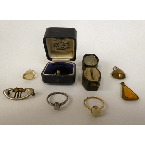 67 - A Charles Horner silver brooch; three similar coloured stone set pendants; a 9ct gold, claw set opal... 