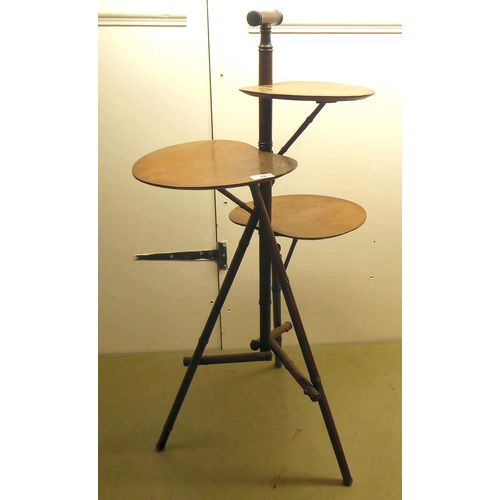 78 - Jas Schoolbred & Co, a late Victorian mahogany, faux bamboo framed, three tier cakestand, raised... 