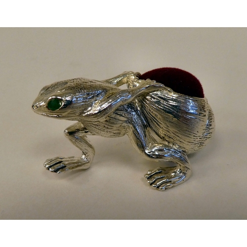 8 - A silver plated novelty pin cushion, a frog with a snail in tow 