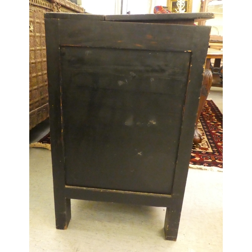 9 - A Chinese black lacquered and panelled elm cupboard with a rising upper section, raised on extended ... 