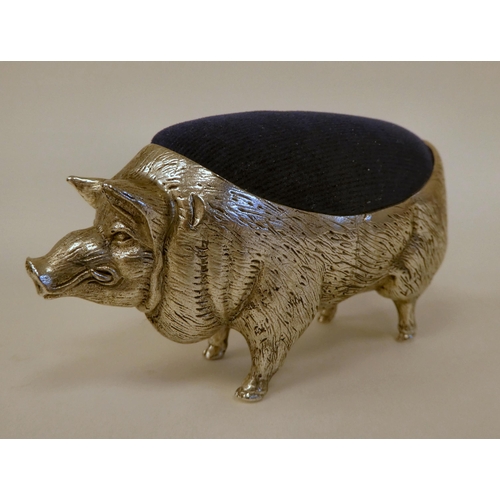 92 - A novelty white metal pin cushion, fashioned as a pig  stamped 800  4