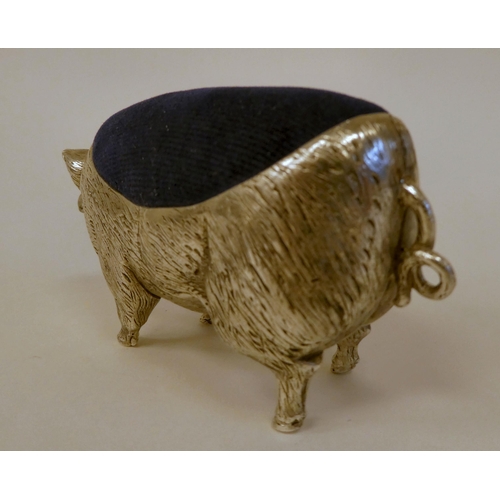 92 - A novelty white metal pin cushion, fashioned as a pig  stamped 800  4