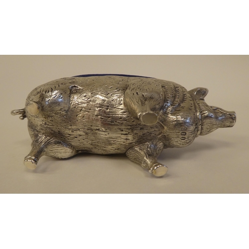 92 - A novelty white metal pin cushion, fashioned as a pig  stamped 800  4