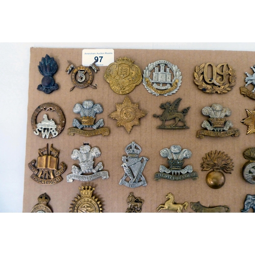 97 - Over fifty British military regimental cap badges and other insignia, some copies: to include Innisk... 