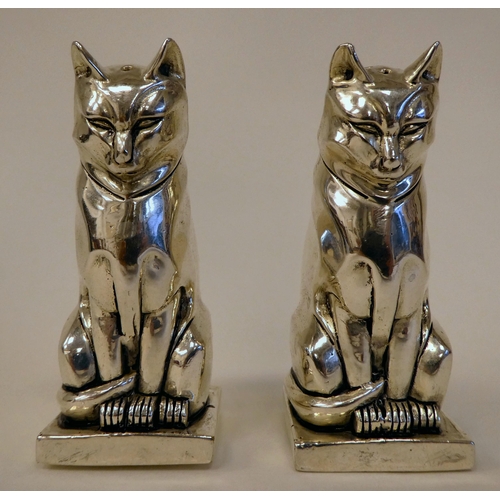 99 - A pair of Egyptian style white metal cat salt and pepper pots  stamped 800