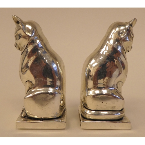 99 - A pair of Egyptian style white metal cat salt and pepper pots  stamped 800