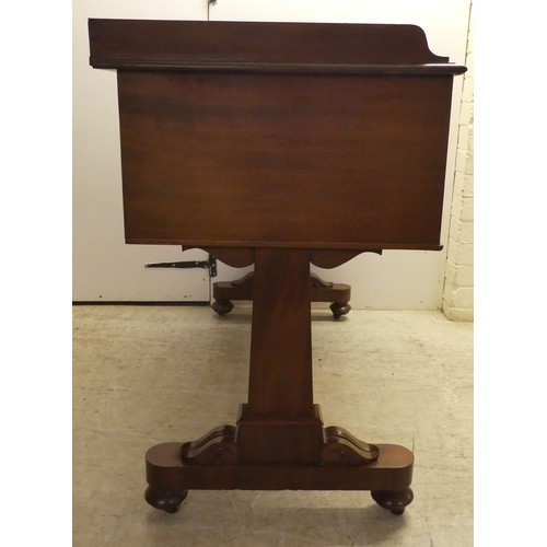 353 - A William IV mahogany desk, the top with a gallery, over five drawers, raised on opposing pillar upr... 