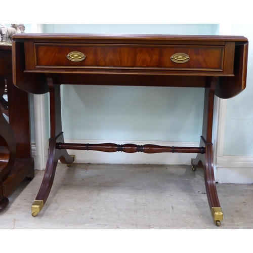 100 - A Re-Furn Heldense Regency style, mahogany finished sofa table with crossbanded and string inlaid or... 