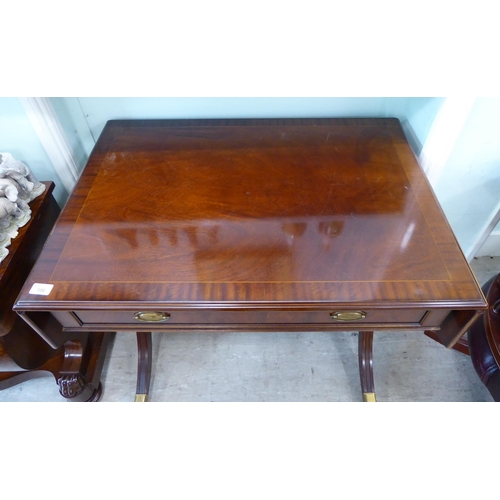 100 - A Re-Furn Heldense Regency style, mahogany finished sofa table with crossbanded and string inlaid or... 