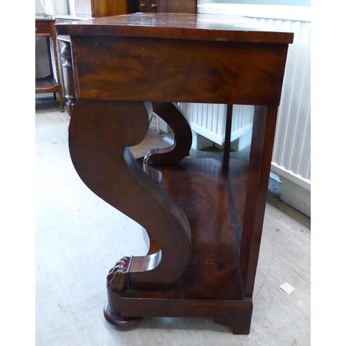 103 - A Regency style mahogany finished serving table, comprising a frieze drawer, elevated on S-shape for... 