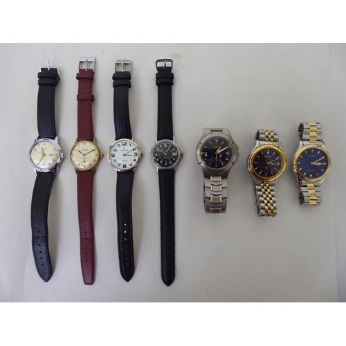 104 - Seven wristwatches: to include a Timex, in a stainless steel case, the black Arabic dial with sweepi... 