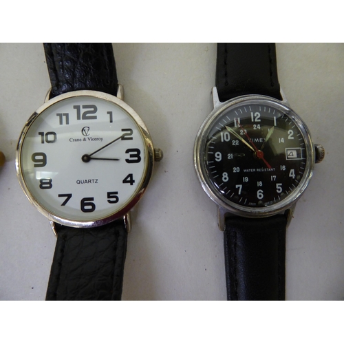 104 - Seven wristwatches: to include a Timex, in a stainless steel case, the black Arabic dial with sweepi... 