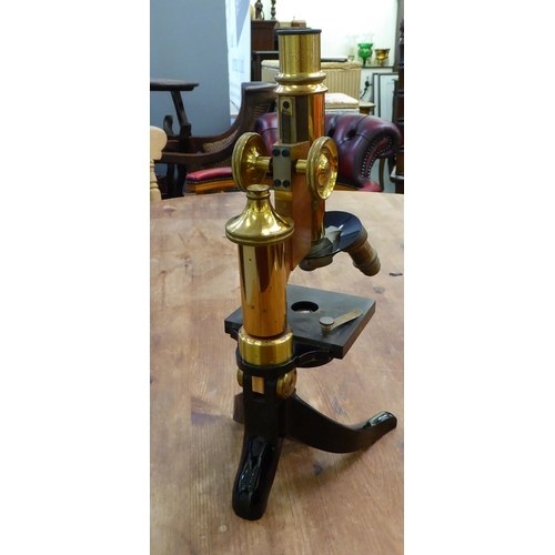 119 - An early 20thC lacquered brass and black enamel L Leitz Wetzlar microscope with two rotating lenses ... 