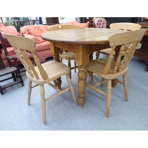 123 - A set of four modern, unpainted beech framed kitchen chairs with solid seats; a contemporary pine br... 