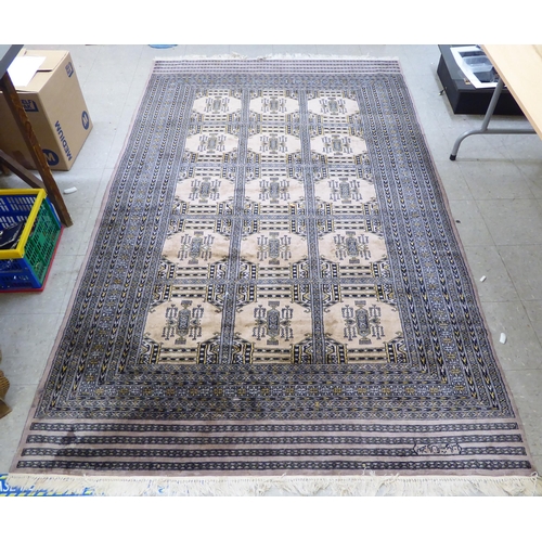 131 - A Persian rug with floral motifs, on a beige ground  62