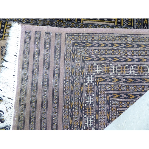 131 - A Persian rug with floral motifs, on a beige ground  62