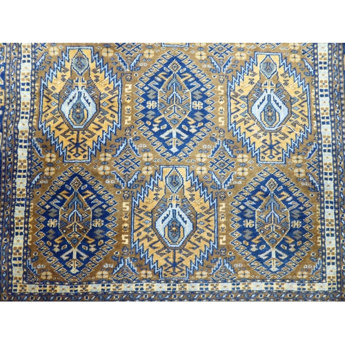 133 - A Persian rug with geometric motifs, on a brown ground  38