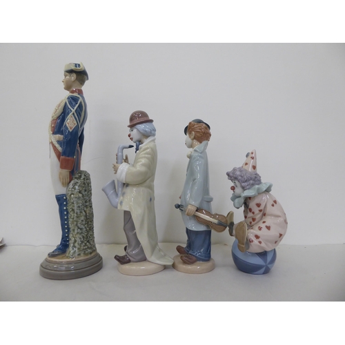 139 - Three Lladro porcelain clown figures  all approx. 9