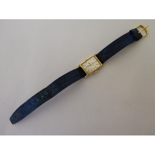 14 - A lady's Omega gold plated stainless steel cased, automatic De Ville wristwatch, faced by a baton di... 