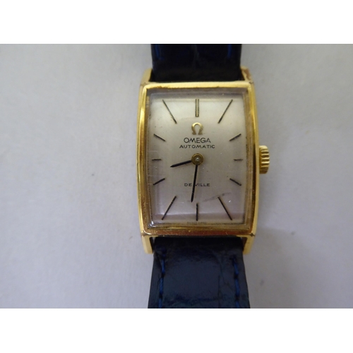 14 - A lady's Omega gold plated stainless steel cased, automatic De Ville wristwatch, faced by a baton di... 