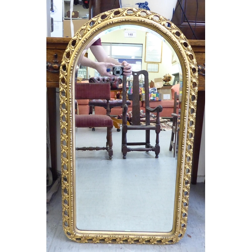 148 - A modern mirror, the arched bevelled plate set in a moulded gilt frame  34