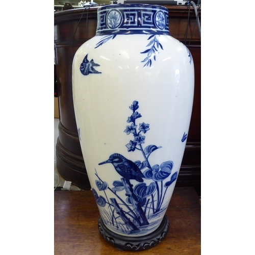 153 - A late Victorian Minton china vase, decorated in blue and white with birds and trees  24